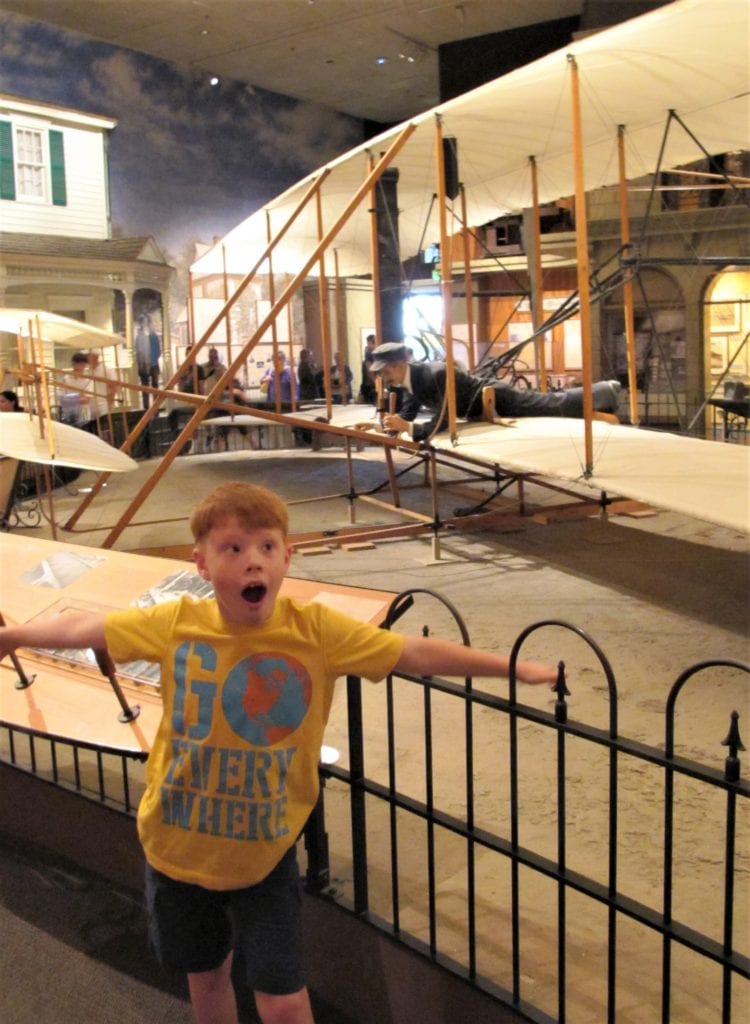 My Excited Airplane-Loving Son in Front of the Wright Brother's Plane at the Air and Space Museum - Washington D.C. with kids