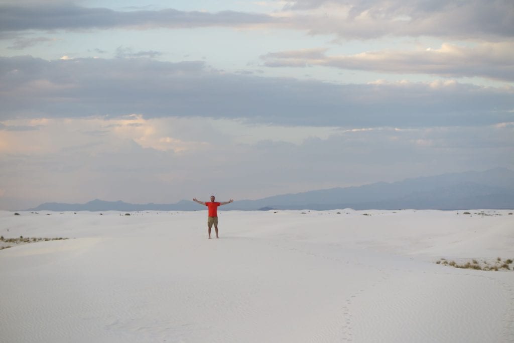 Standing Alone in almost complete whiteness at White Sands National Park near sunset, New Mexico