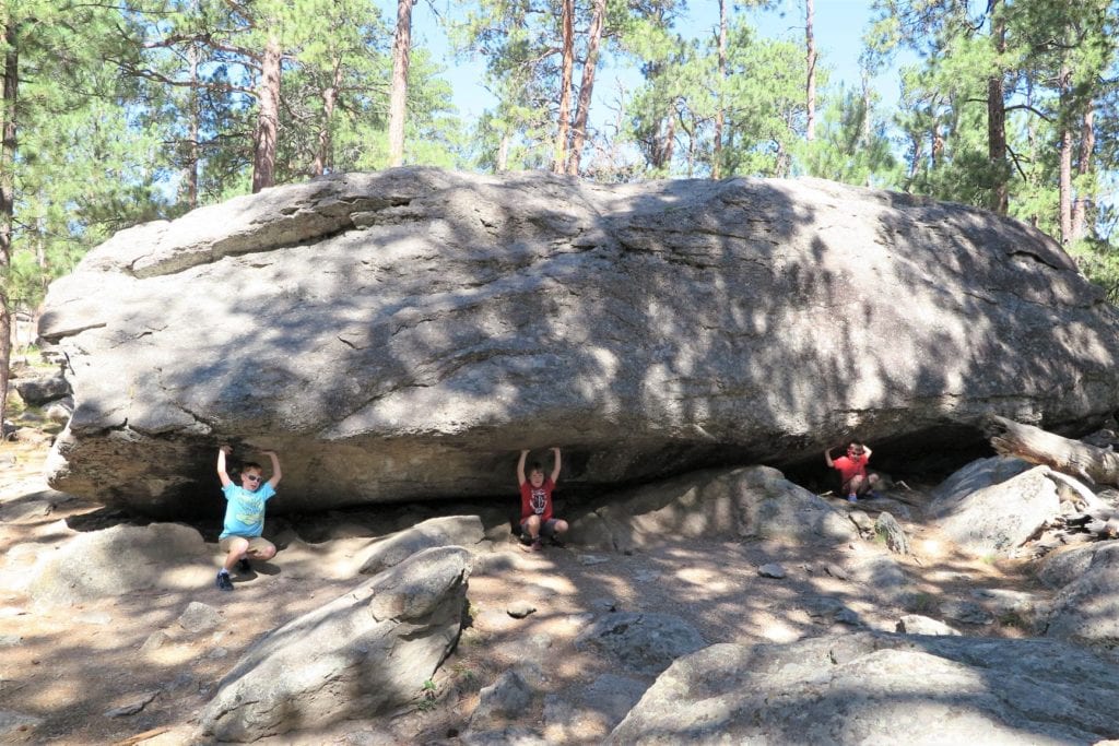 Holding up an enormous boulder on Tower Trail, Devils Tower, Wyoming - fun picture ideas