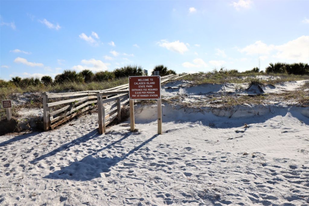 Caladesi Island State Park Sign and boardwalk from the beach to the concessions and restrooms - Florida