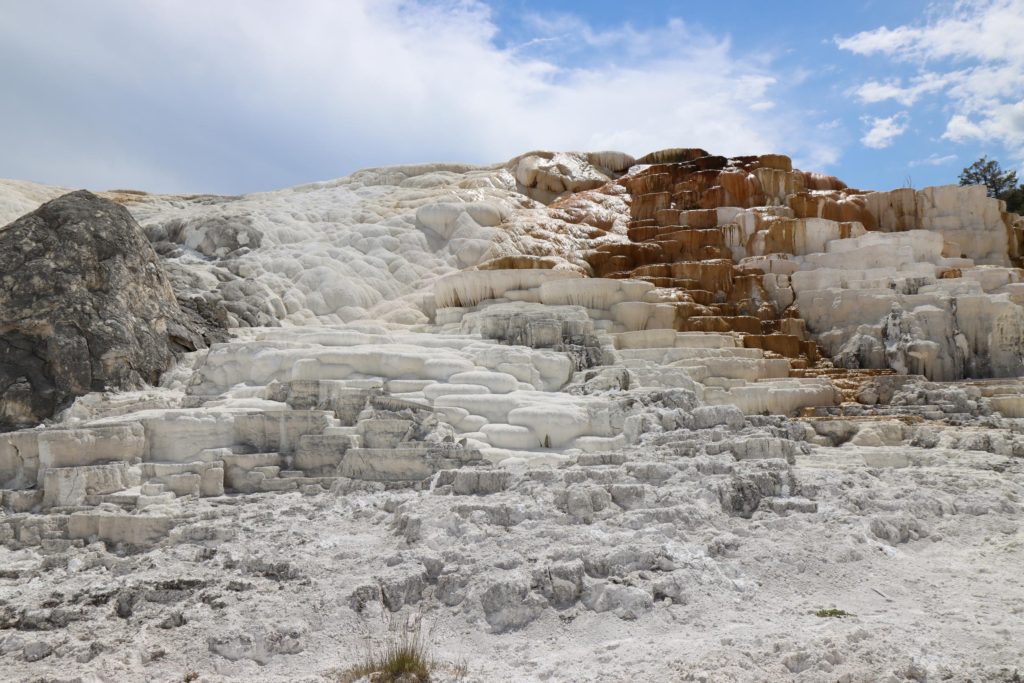Bizarre White shelf formations at Mammoth Hot Springs - Yellowstone Itinerary - Devils Thumb - Wyoming