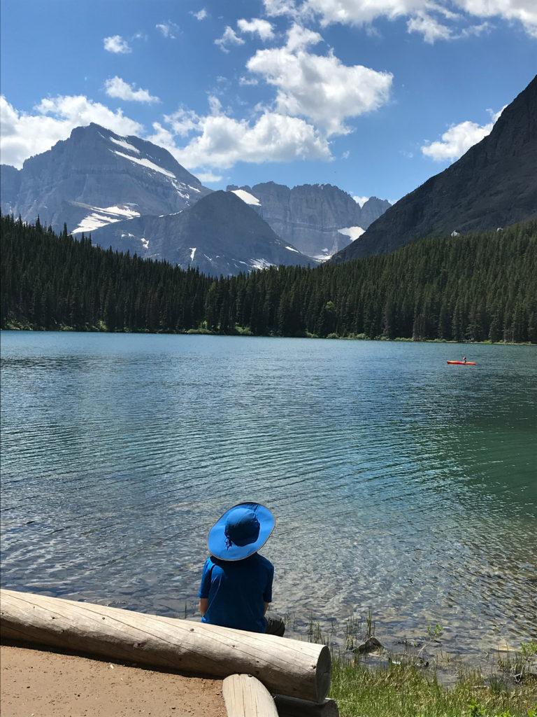 Sitting by the lake in front of the Many Glacier Hotel - Glacier National Park, Montana