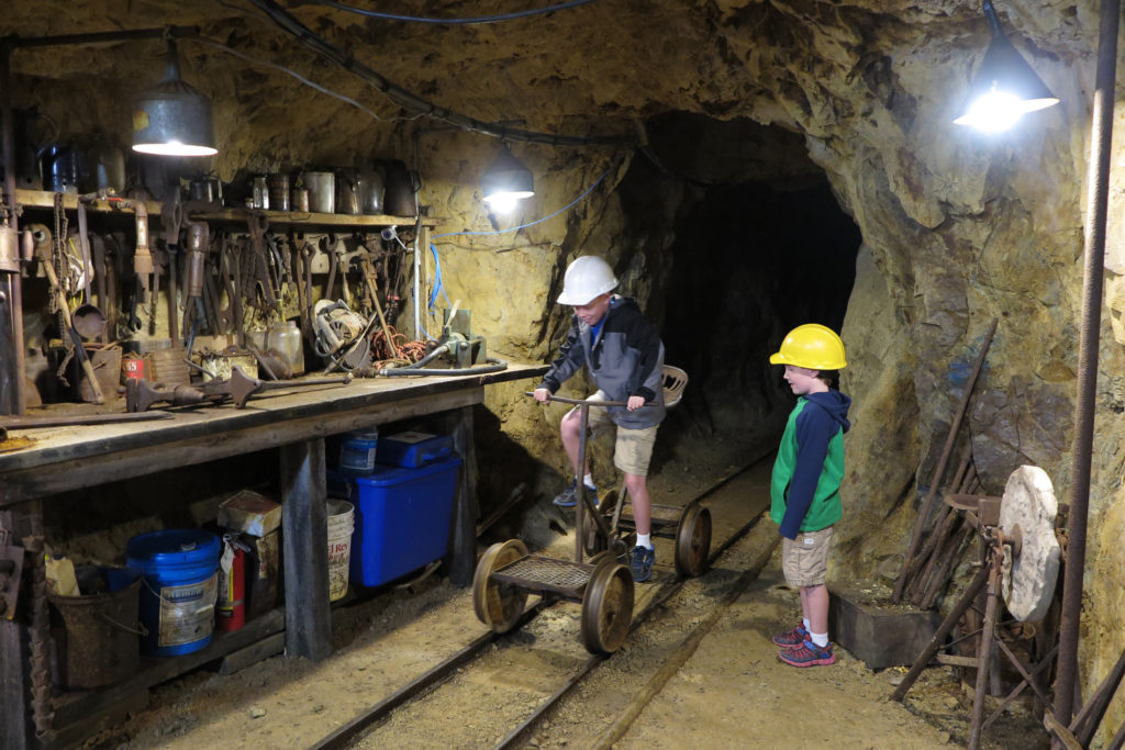 Trying out mining cars at Mollie Kathleen Mine, Colorado - A Great thing to do with kids