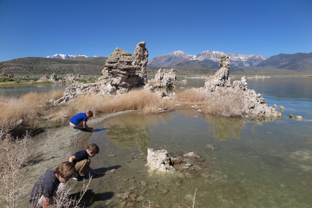 Touching the water at Mono Lake with its bizarre tufa formations, California