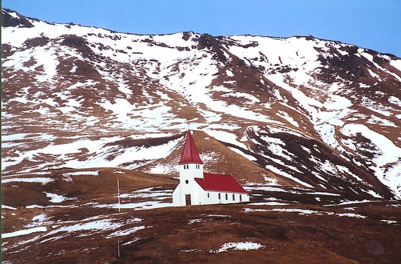Picturesque Iceland Church with Snowy Mountain Background